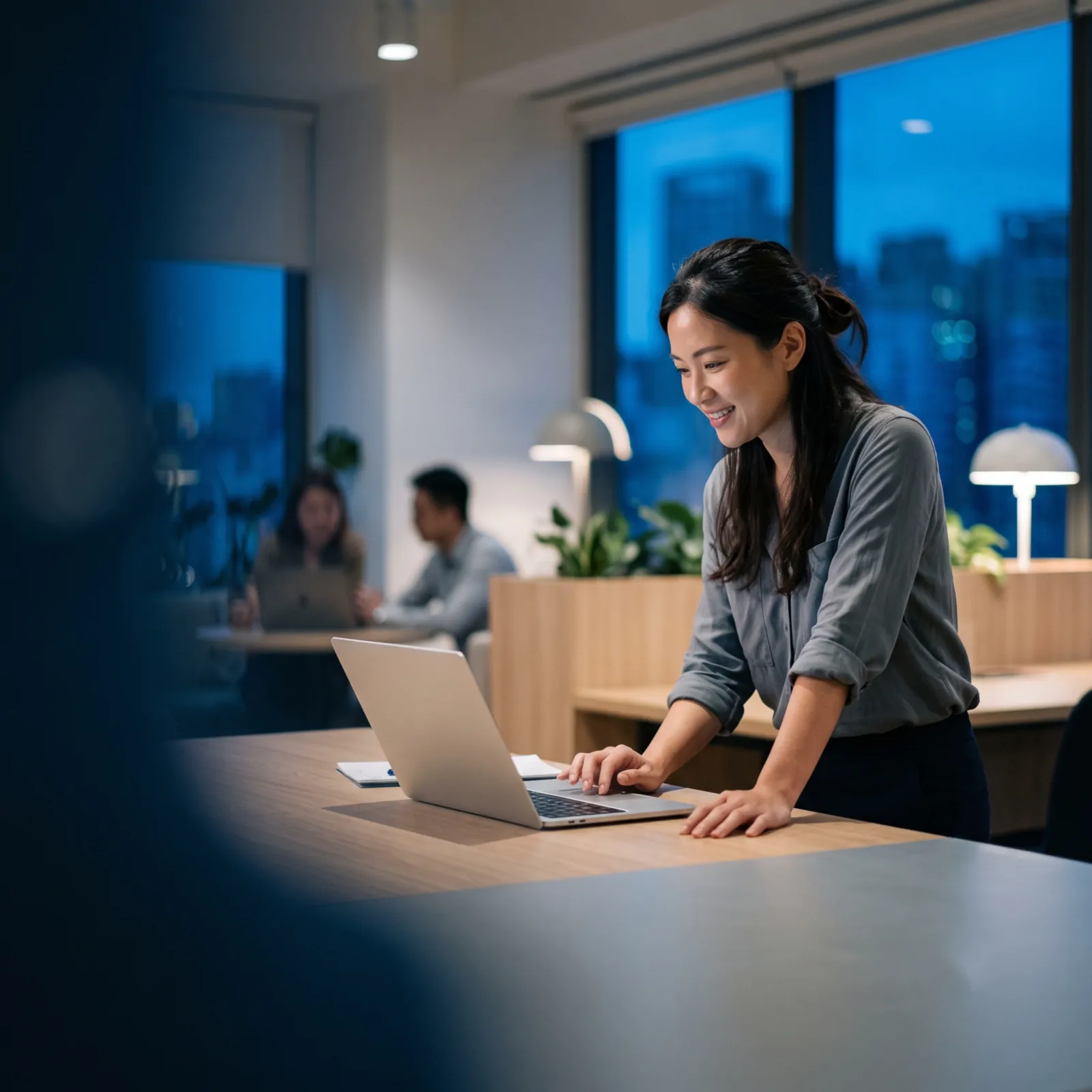A founder working at her laptop in her startup office