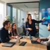 Team discussing charts and dashboards in a meeting room